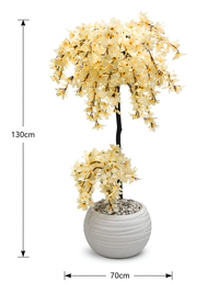 Arbre aux Fleurs de Soie artificiel premium dans un pot blanc design, avec fleurs ivoire réalistes, placé dans un salon moderne et lumineux au Maroc.