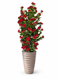 Camélia artificiel 180 cm aux fleurs rouges éclatantes et feuillage dense dans un pot haut texturé ondulé