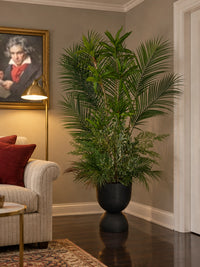 Plante artificielle Panoramique Végétal de 170 cm installée dans un coin de salon chic et chaleureux avec tableau et éclairage d'ambiance